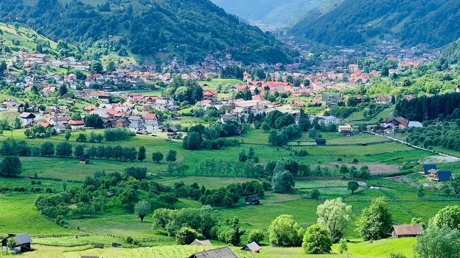Summer in Rucăr: the village in the valley, ringed by pastures and forest