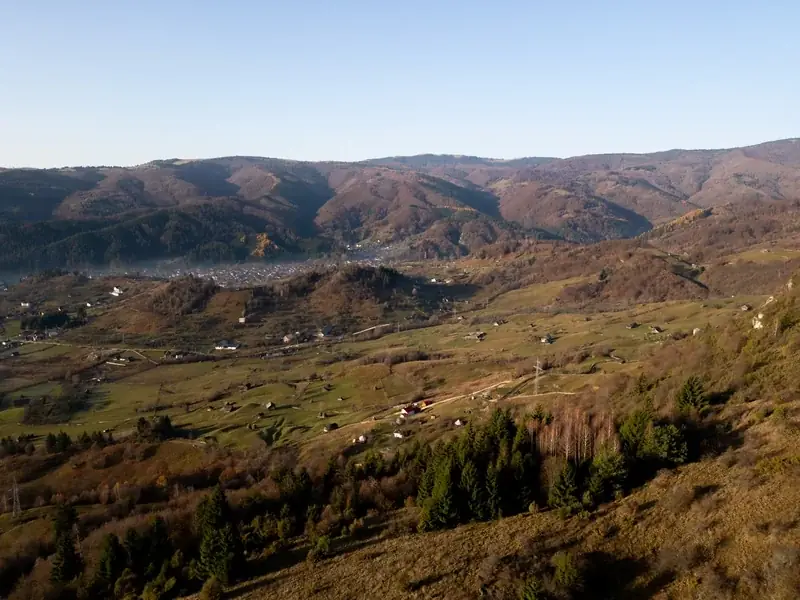 The view from the terrace over the hills and valley in autumn colors