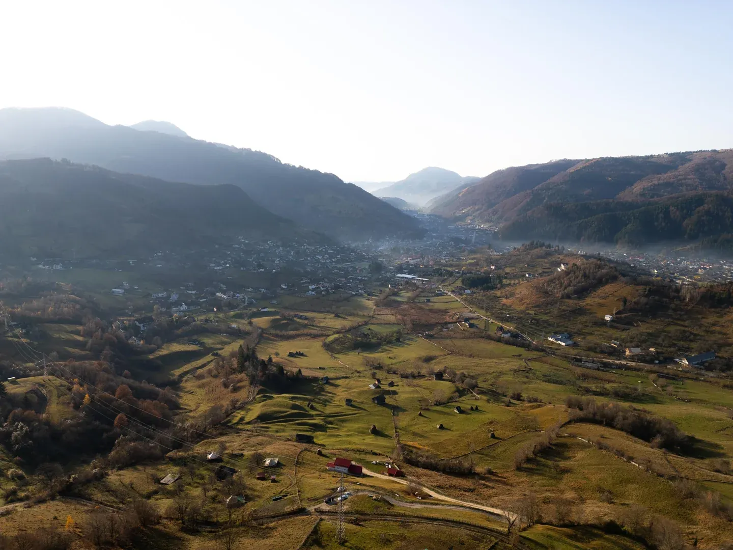 Low sun over the valley, with the hills backlit