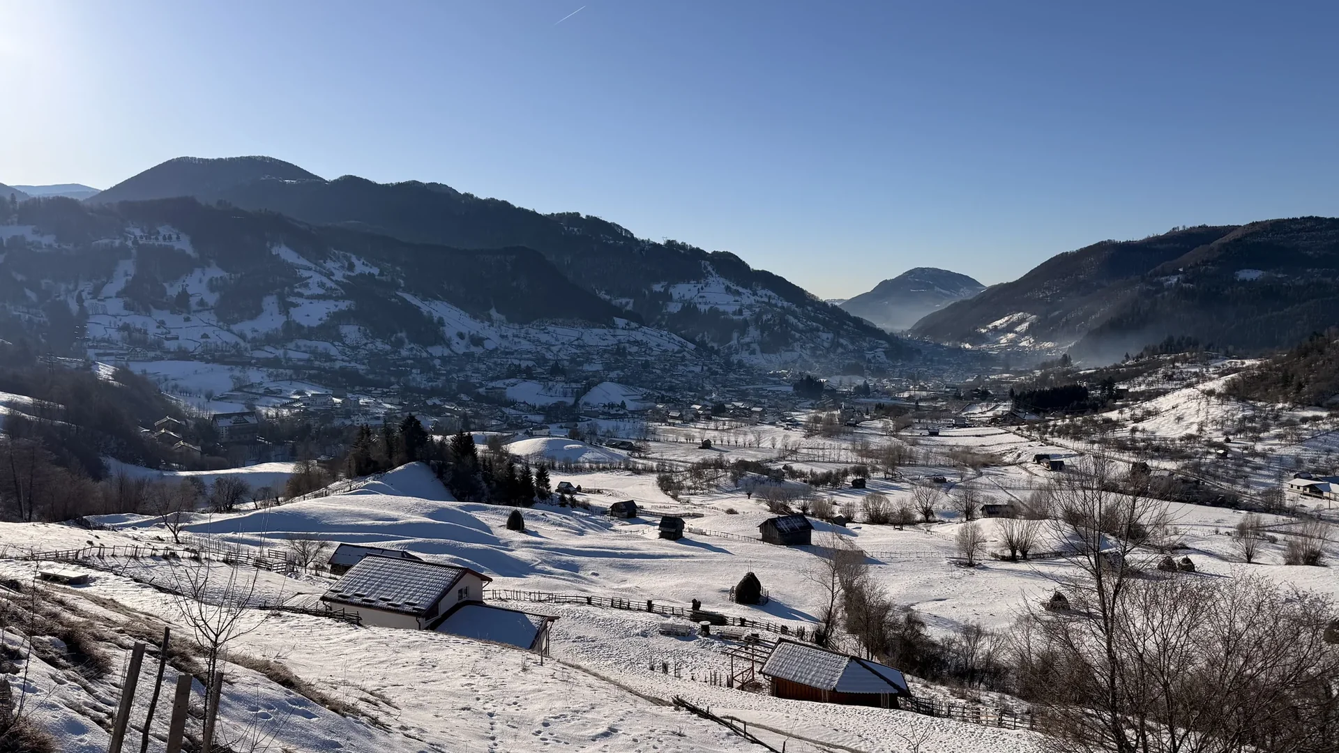 Courtyard and mountain landscape in winter at the guesthouse in Rucar